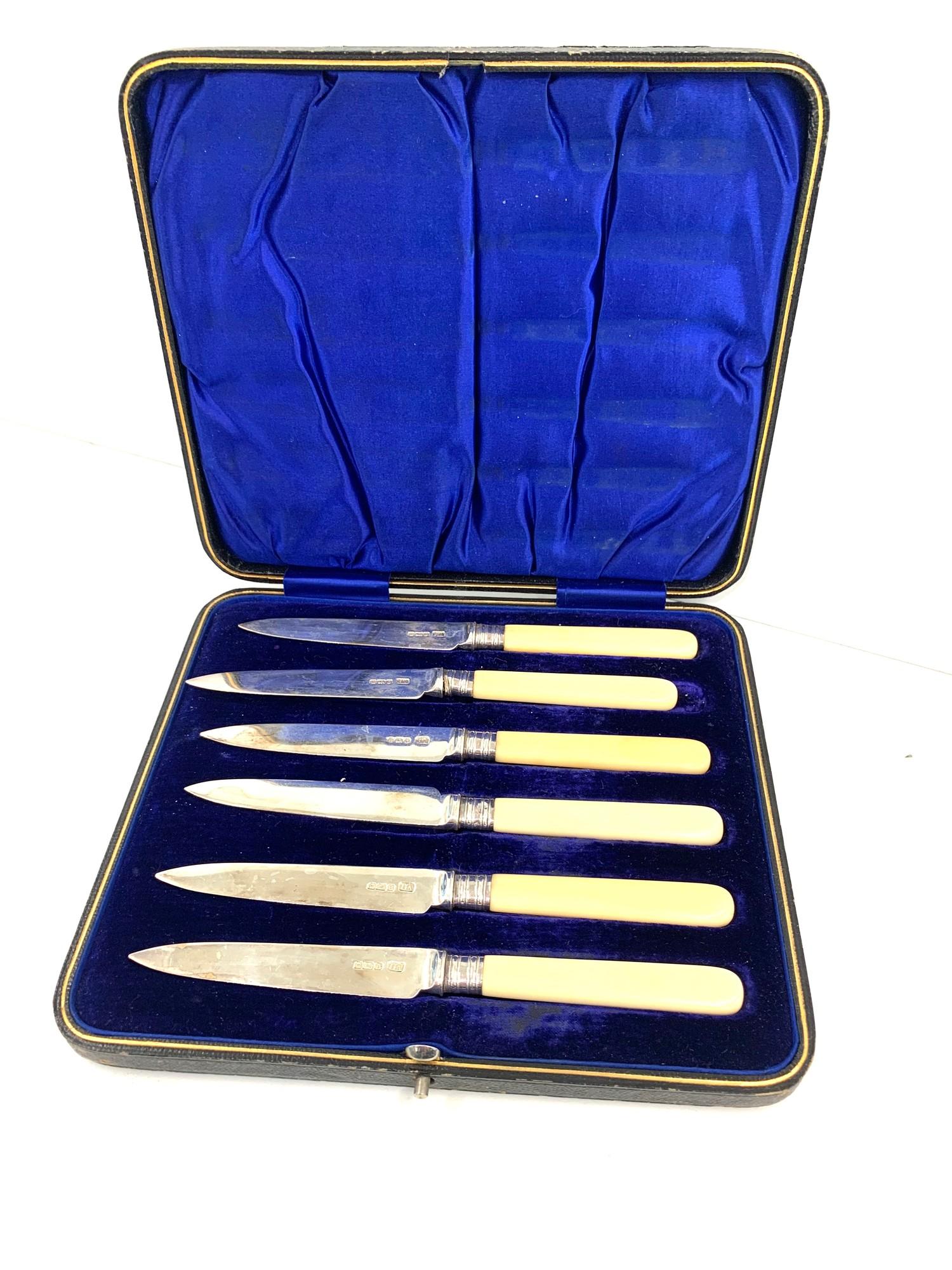 Boxed set of silver bladed knives please see images for details