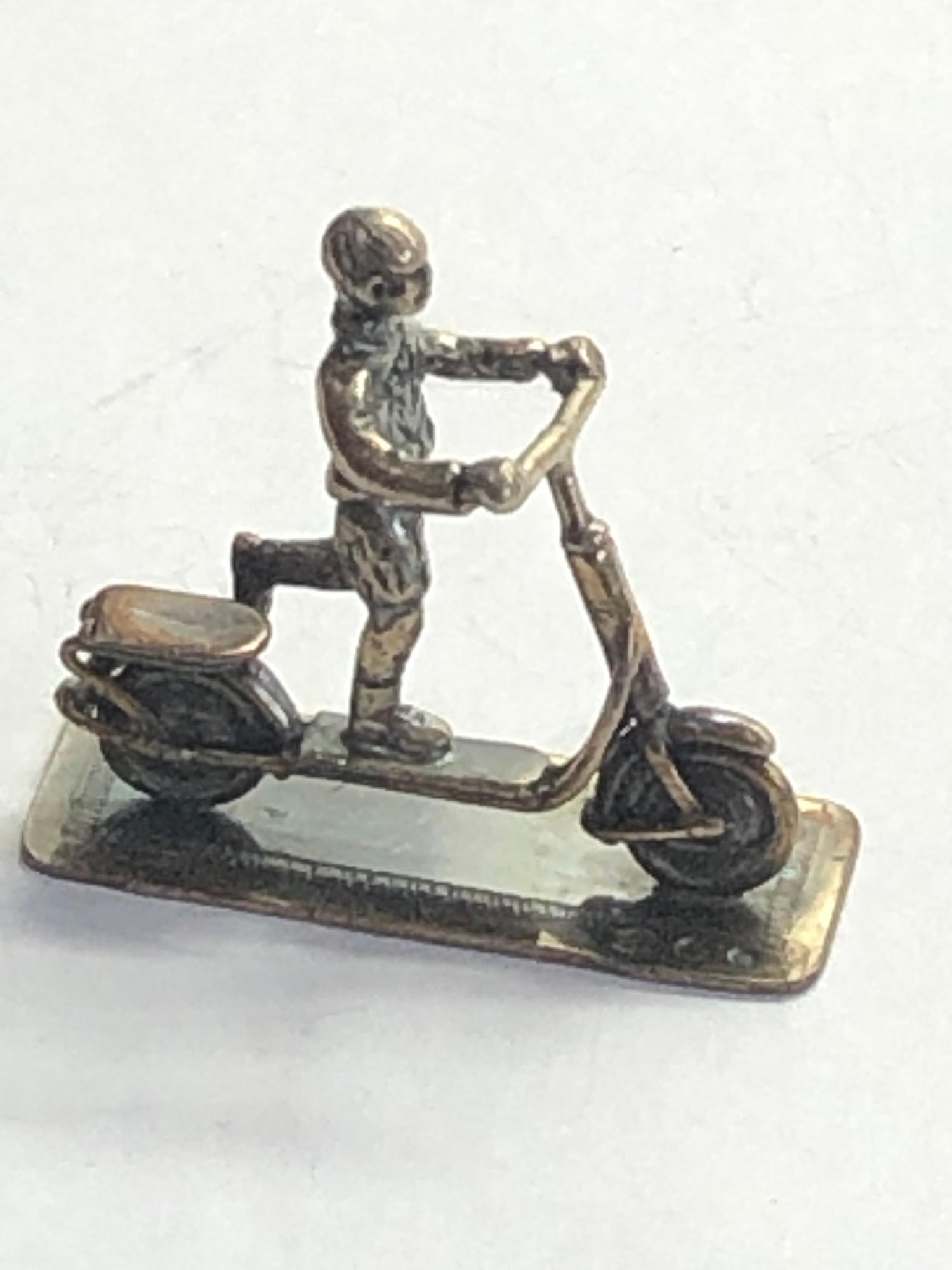 Vintage Dutch silver miniature boy on his scooter dutch silver hallmarks please see images for