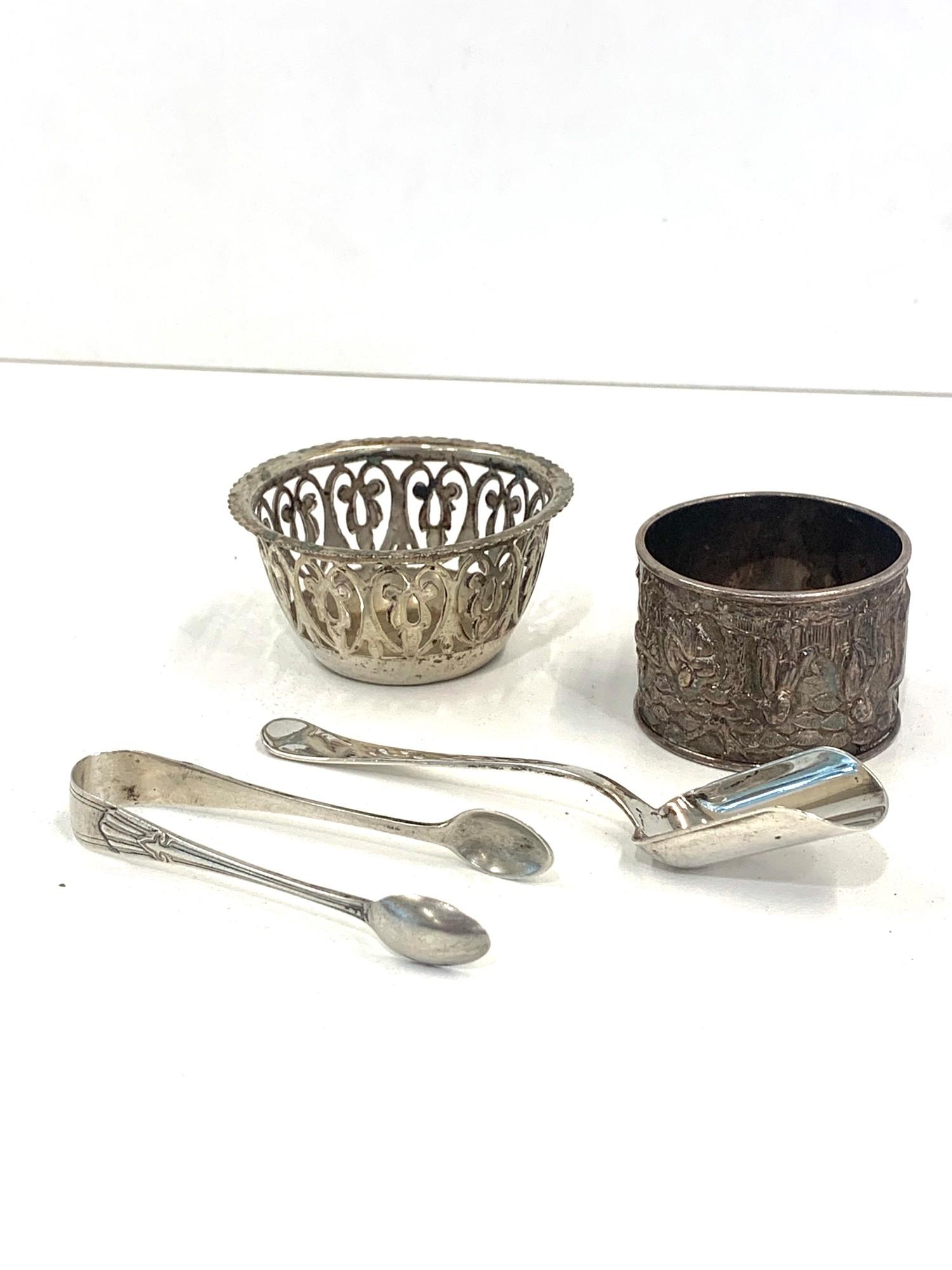 Selection of silver items includes napkin ring, sugar tongs etc approximate weight 94.1g