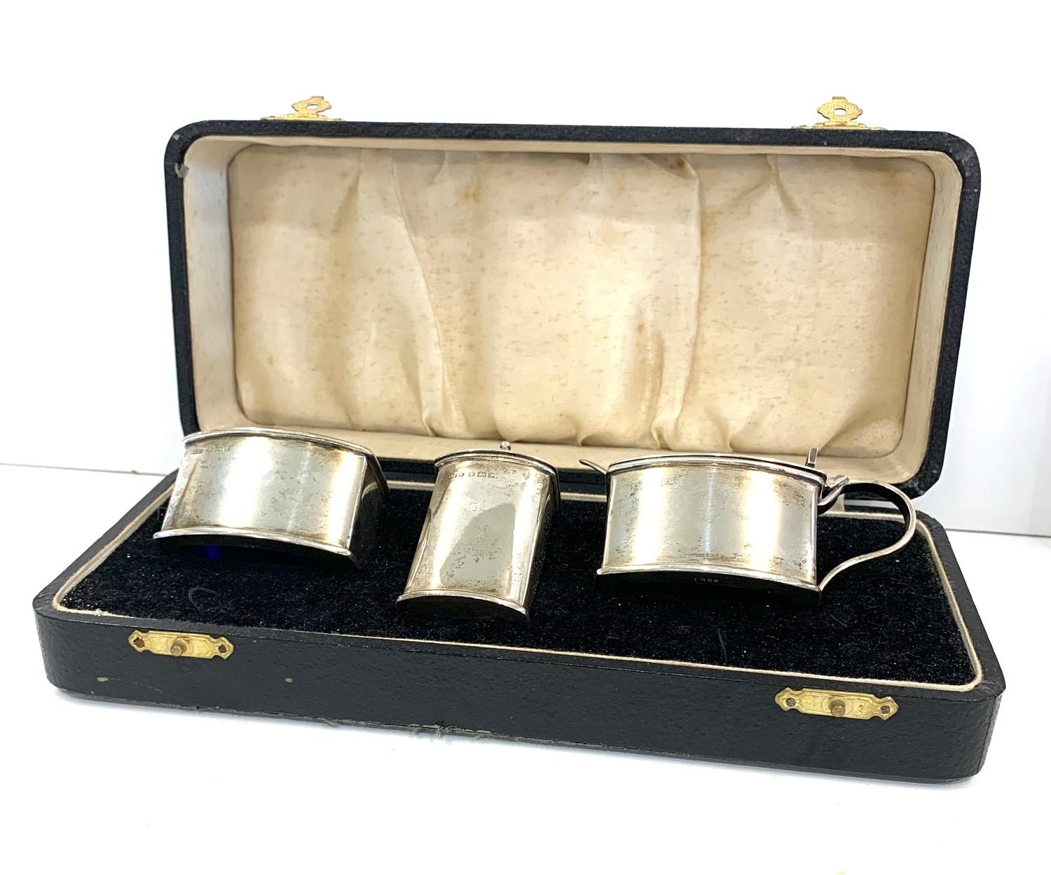 Boxed silver cruet set with spoons and blue glass liners Birmingham silver hallmarks