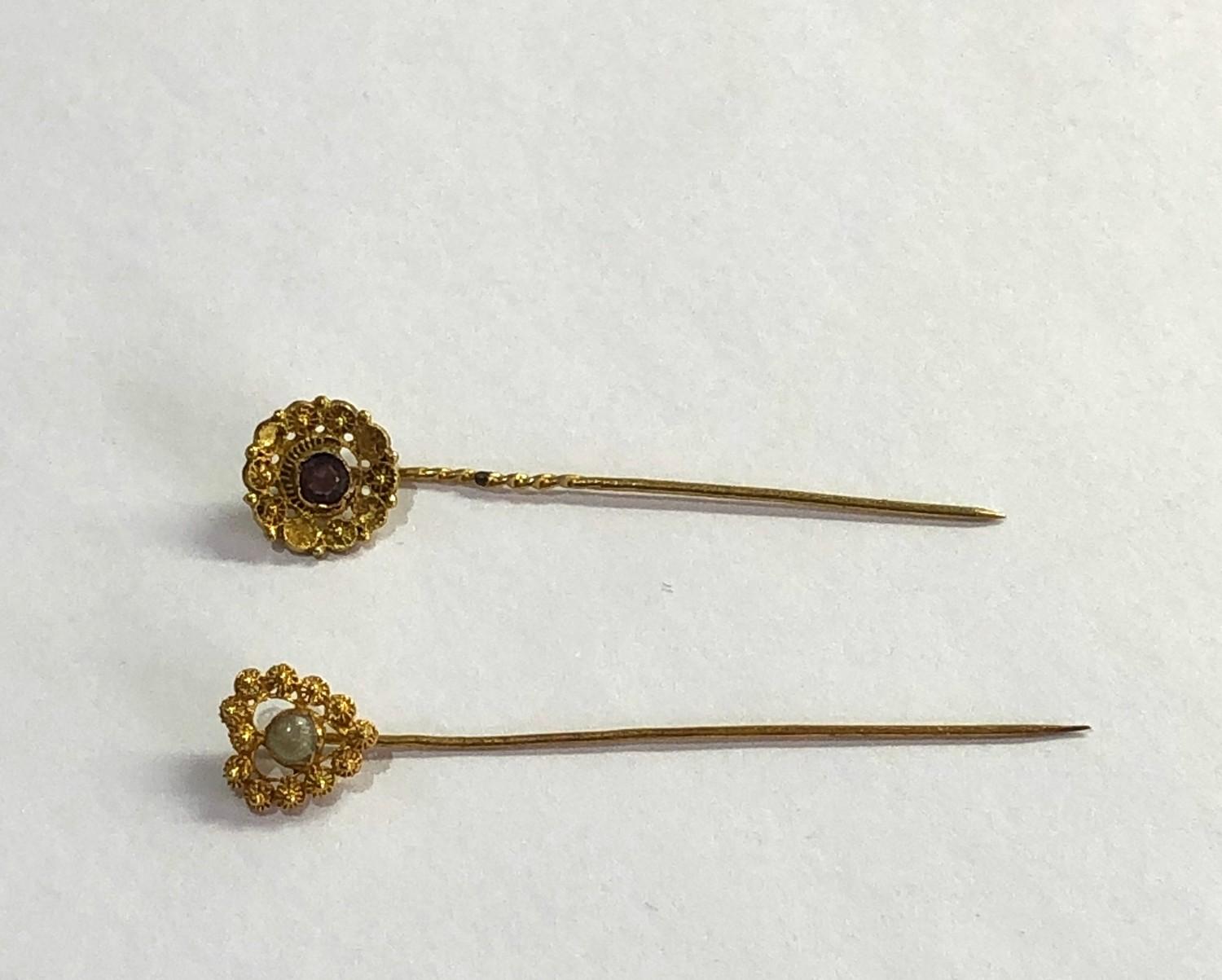 2 antique dutch gold stick pins acid test at least 14ct one set wit pearl the other an amethyst