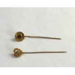 2 antique dutch gold stick pins acid test at least 14ct one set wit pearl the other an amethyst