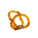Vintage amber bead bracelet with silver clasp