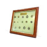 Collection of Boer war era badges and pins depicting generals of the era framed