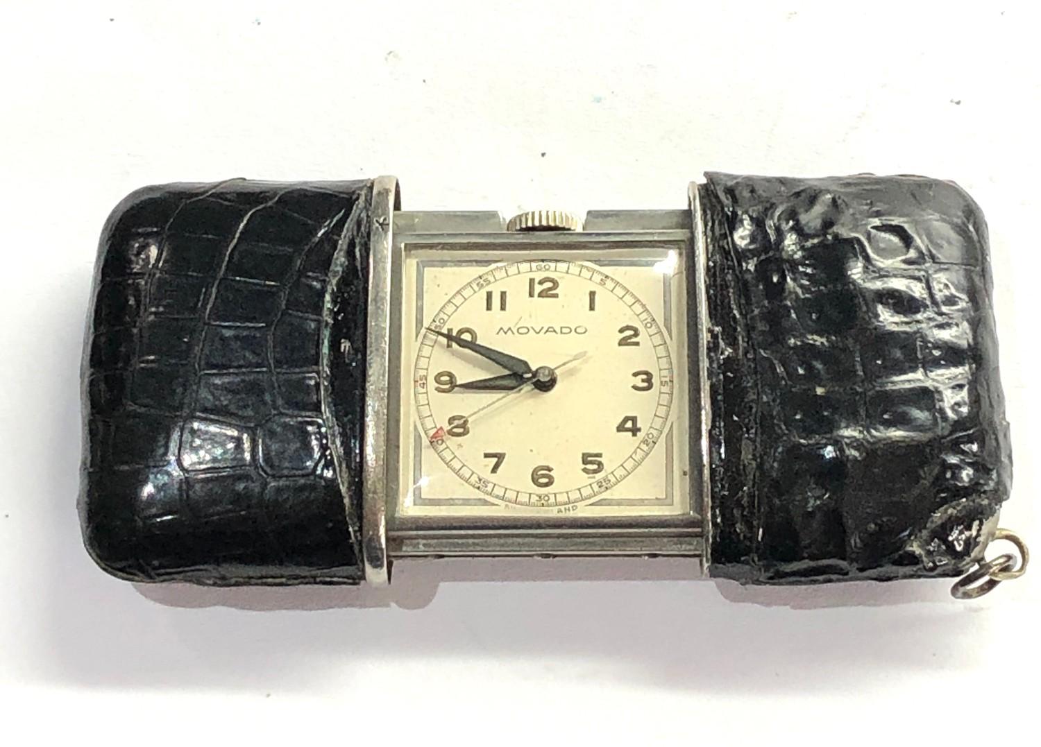 Movado purse watch black leather case the centre second watch is in good working condition shown