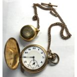 Gold plated double Albert chain with sovereign case and pocket watch winds and ticks missing glass