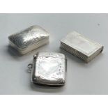 2 silver pill boxes and a silver vesta case