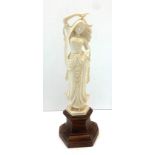 Carved bone figure on wooden stand measures approx 26cm please see images for details