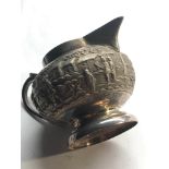 Large vintage asian silver embossed milk jug not hallmarked but tested as silver measures approx