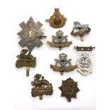 Selection of military cap badges