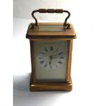 Vintage brass carriage clock winds and ticks but no warranty given no key