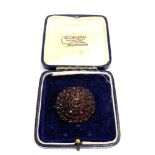 Antique garnet brooch measures approx 35mm by 32mm 3 small garnets missing from central head