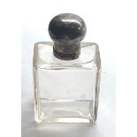 Silver top perfume bottle with glass stopper measures approx height 11cm in good condition