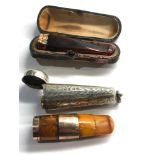 2 gold mounted amber cheroot holders cased n silver and leather cases age related wear and damage