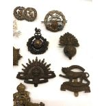 Selection of military cap badges etc