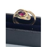 14ct gold snake ring set with red gemstone 4.1 g