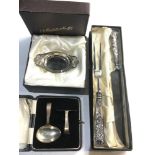 3 Boxed silver items includes baby feeder sweet dish and silver handled carving knife and fork