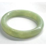 Jade type bangle measures approx 8.5cm diameter