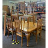 Shoolbred dining table and 6 chairs, 1 carver