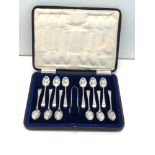 Boxed set of 12 silver tea spoons with sugar tongues London silver hallmarks