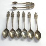 Set of six ornate silver tea spoons and sugar nips