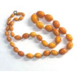 Antique egg yolk amber bead necklace largest beads measure approx. 22mm by 16mm weight 54g