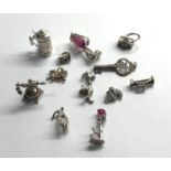 Selection of 12 vintage silver charm bracelet charms