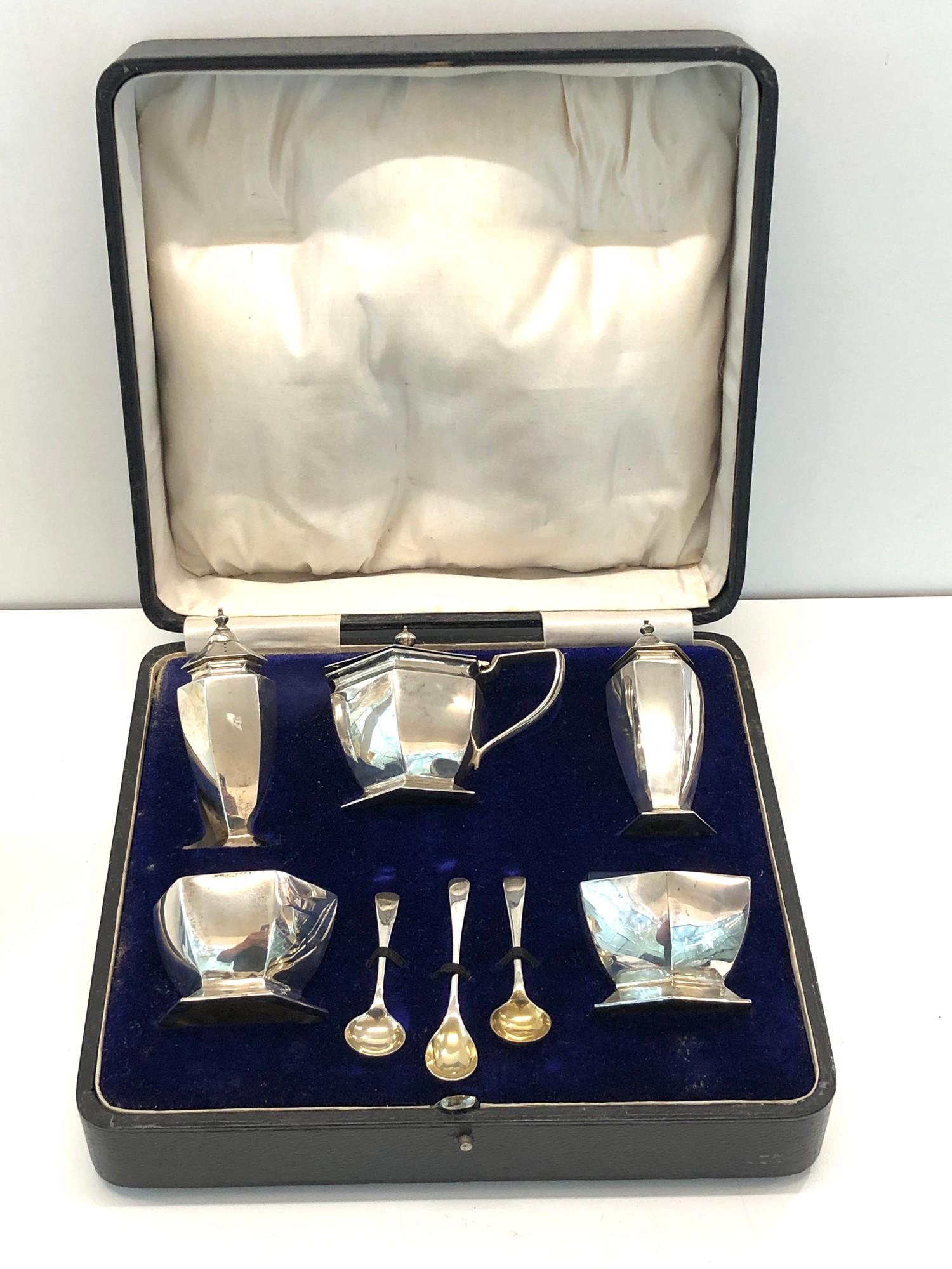 Boxed silver cruet set complete with spoons blue glass liners in fitted case Birmingham silver