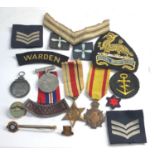 Selection of military medals patches badges etc