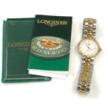 Gents Longines v.h.p.quartz wristwatch with booklet in working order but no warranty is given