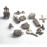 Selection of 12 vintage silver charm bracelet charms
