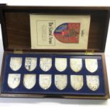 Boxed set of silver the royal arms shields boxed with certificates in celebration of queen Elizabeth