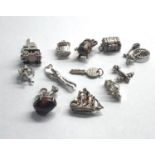 Selection of 12 vintage silver charm bracelet charms