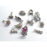 Selection of 12 vintage silver charm bracelet charms