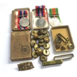 Boxed WW2 medals with buttons etc