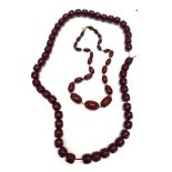 2 Cherry amber bakealite bead necklaces, barrel shaped beads, no internal streaking, approximate