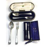 Selection of silver items includes boxed pickle forks and boxed table spoon and fork and victorian