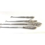 4 silver handled button hooks please see images for details