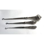 3 Silver handled button hooks largest measures approx 24cm long please see images for details