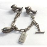 Unusual silver bracelet with dutch silver water jug pendants and silver ingot dutch silver sword