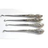 Selection of 4 silver handled button hooks please see images for details