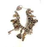 Silver charm bracelet weight 65g