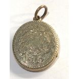 Antique Gold and enamel back and front locket measures approx 34mm by 26mm please see images for