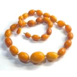 Antique egg yolk amber bead necklace largest bead measures approx 27mm by 21mm weight 50g