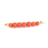 Antique 18ct gold and coral brooch 85mm long argest coral bead measures approx 10mm by 9mm weight