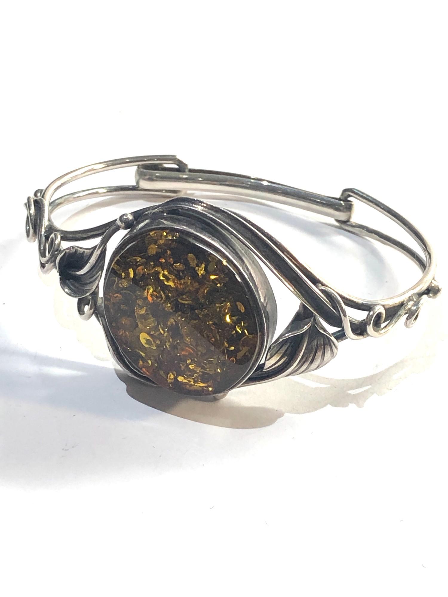 Vintage silver bangle with large amber centre