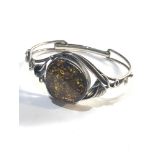 Vintage silver bangle with large amber centre