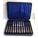 Boxed set of silver handle knifes and forks please see images for details