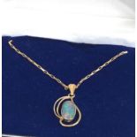 9ct gold black opal pendant and chain opal measures approx 14mm by mm