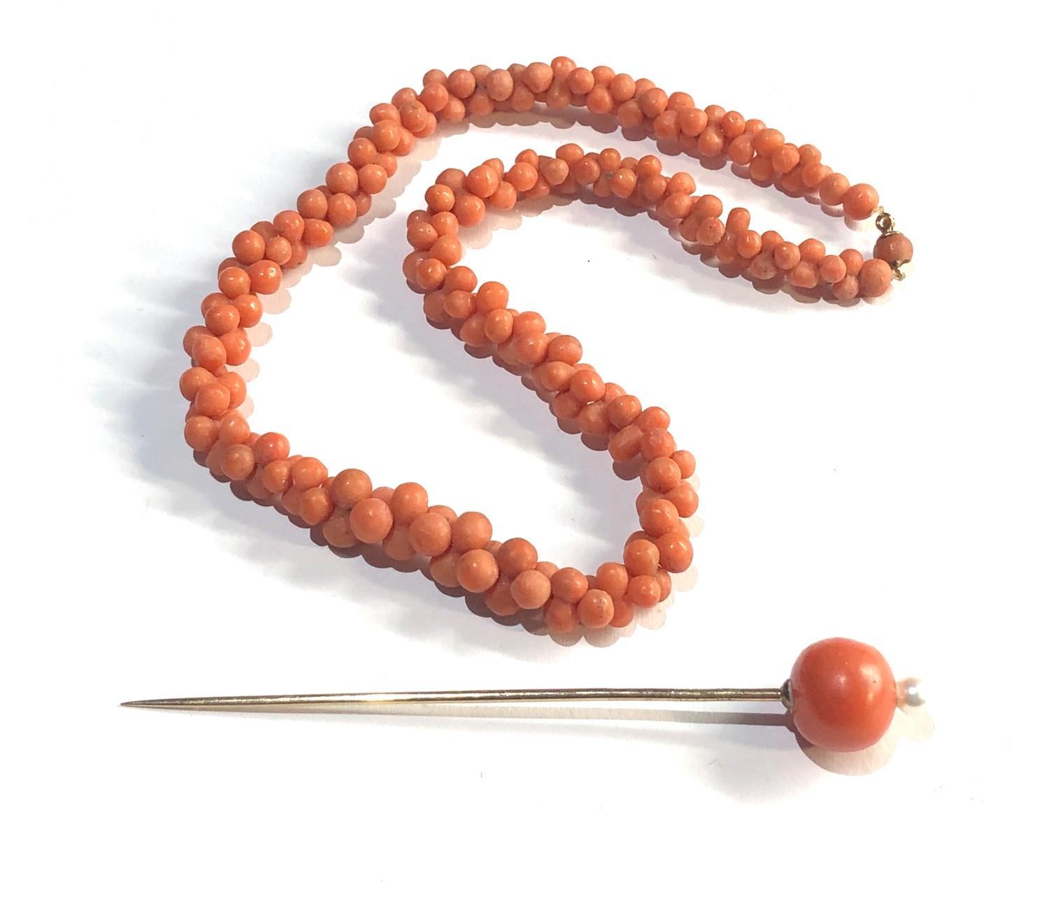 Antique coral bead necklace and 9ct & coral bead stick pin